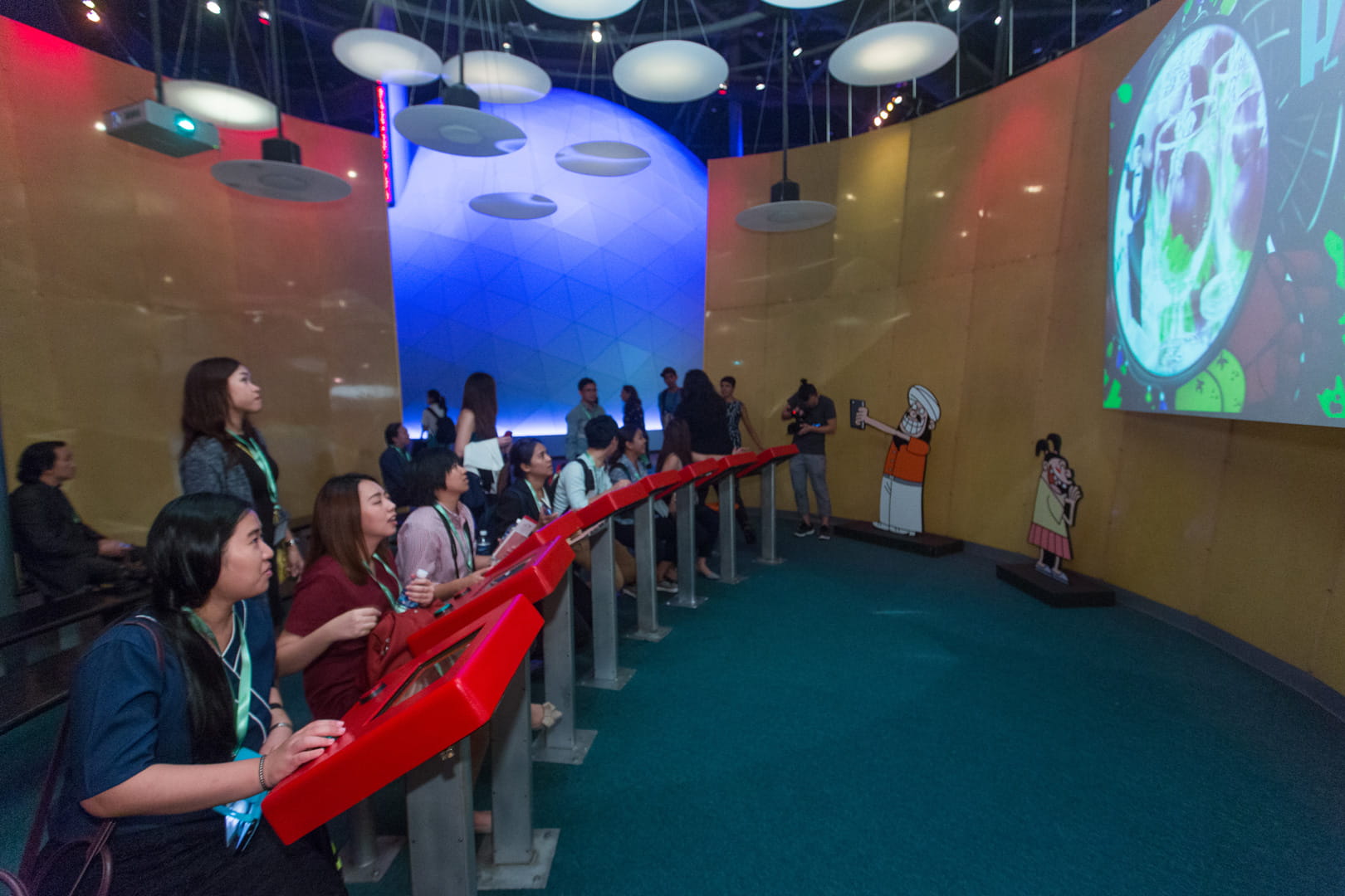 Participants learning about the Singapore story through interactive exhibits which display the country’s history and future plans at the Singapore Discovery Centre