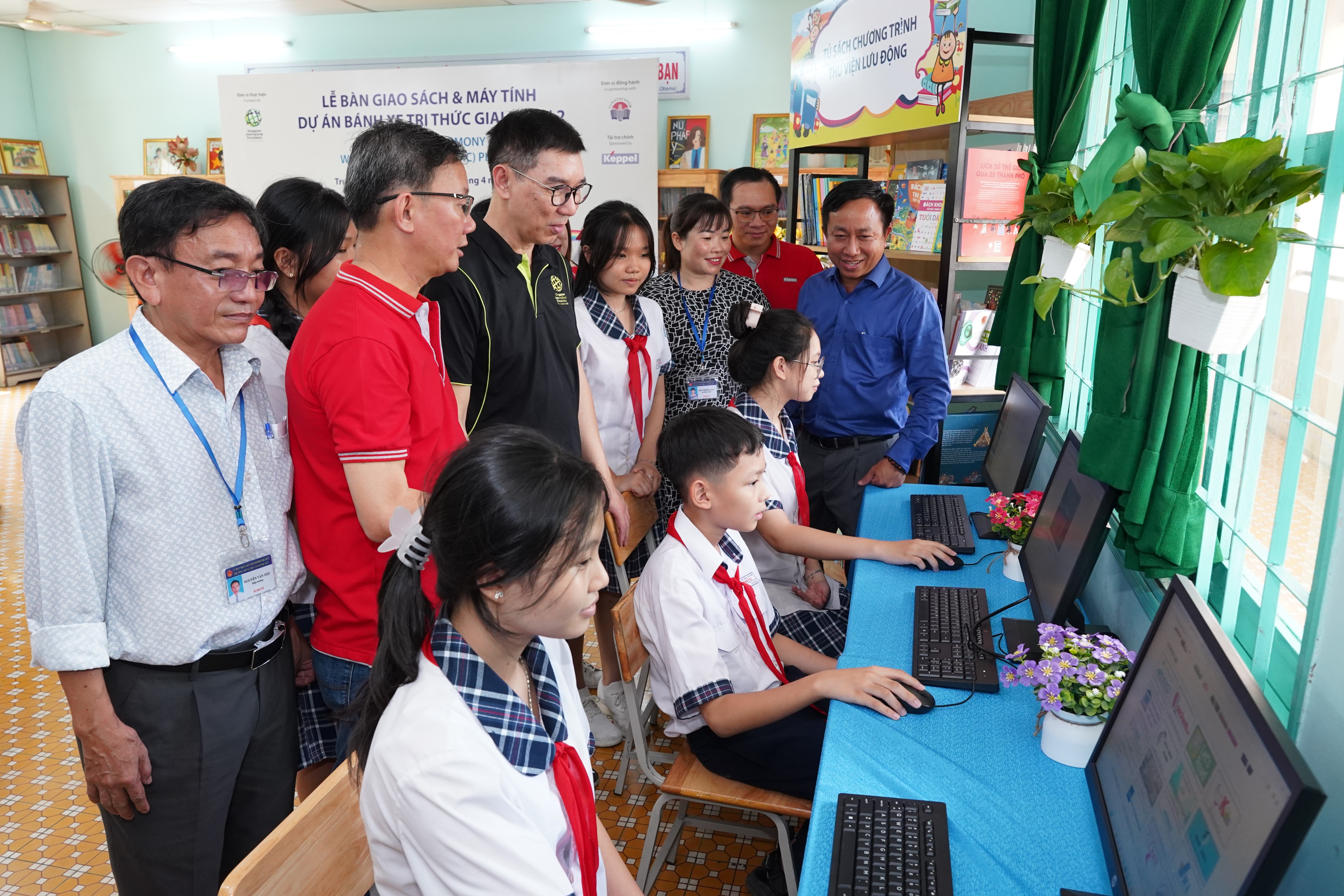 Students using the new computers at the refurbished school library.